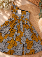 Robe bras cassé enfant en wax, coloris Honey Pinwheel, vue à plat